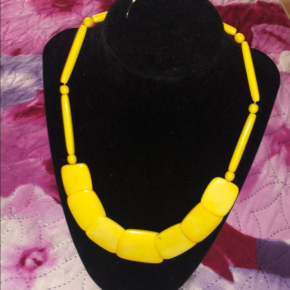 Yellow necklace, made from shell.